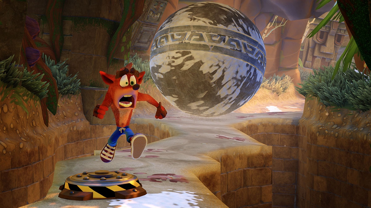 Crash Bandicoot running away from a giant boulder in Crash Bandicoot N. Sane Trilogy.