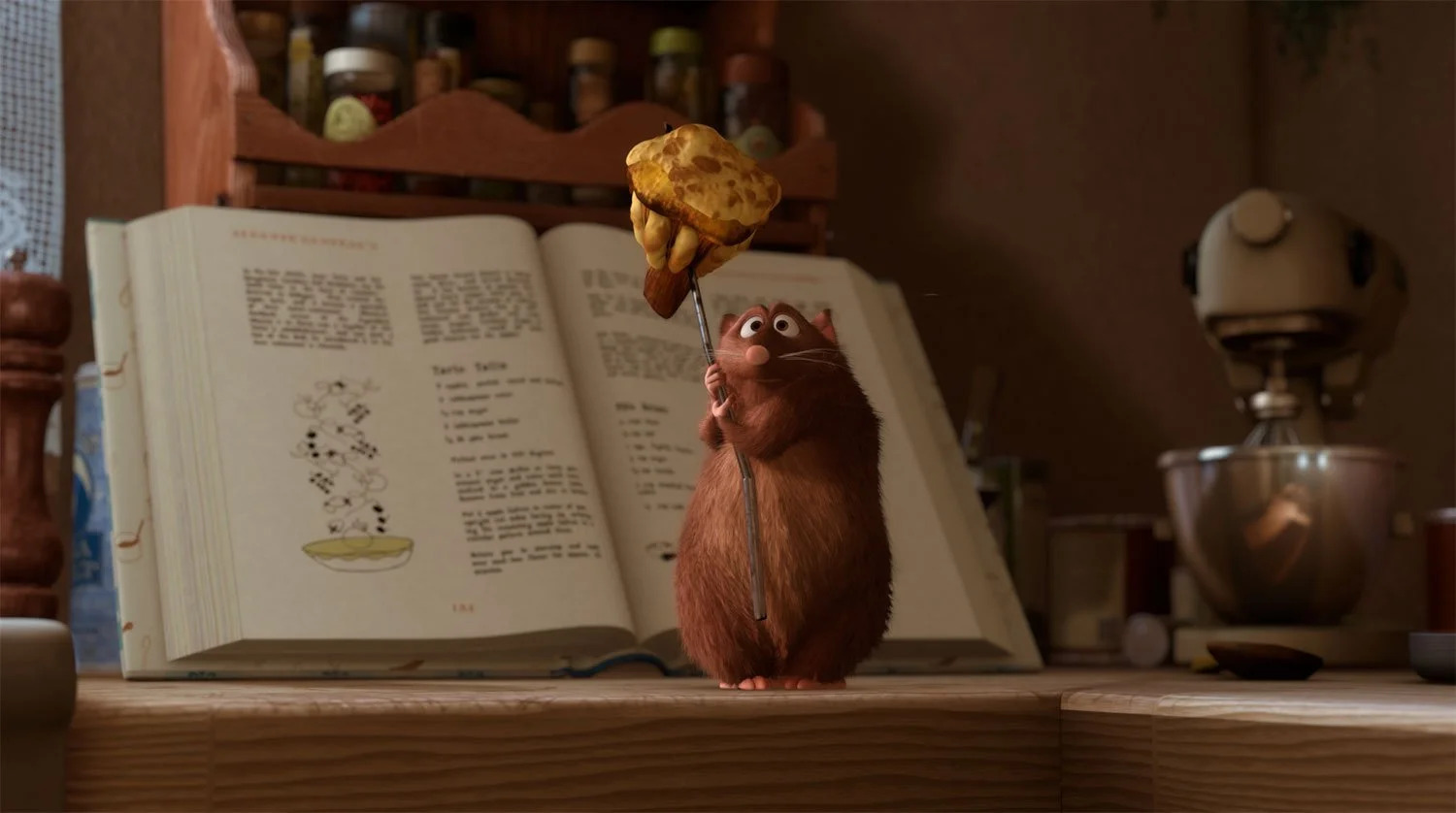Emile holding food in Ratatouille